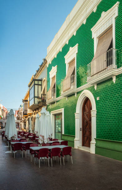 Street view in the city center of Ayamonte in Spain, with beautiful old house with green tiles. stock photo