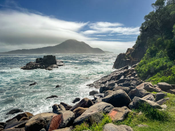 istock Rugged surf and rocks at headland 1386860017