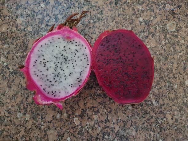 istock Dragon fruit or pitaya, red and white cut in half, isolated 1386861467
