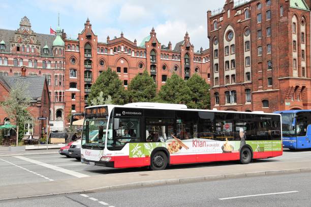 People ride public bus in Hamburg. Hamburger Hochbahn operates underground and most buses in Hamburg. It employs 4,300 people.