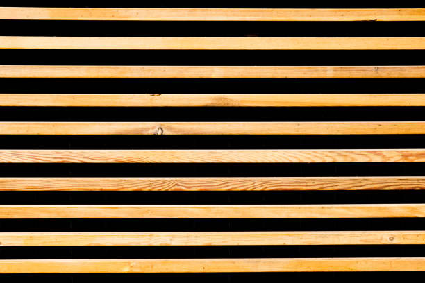 istock Raw brown wooden wall background. Rustic tree desk with knots pattern. Countryside architecture wall. 1386864524