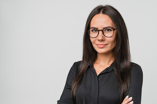 Confident caucasian young businesswoman freelancer CEO boss manager bank employee in glasses and formal wear looking at camera isolated in white background