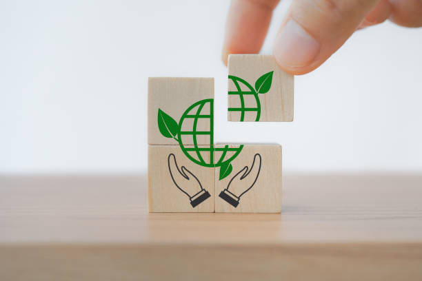 istock hand complete green globe icon on cube ,CSR, eco green sustainable living, zero waste, plastic free, earth day, world environment day, responsible consumption Social responsibility core value concept 1386867624