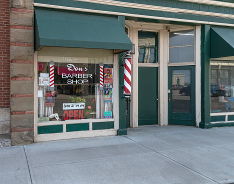 Fort Macleod, Alberta, Canada – March 17, 2022:  Exterior view of “Don’s Barber Shop” in the town’s historic downtown