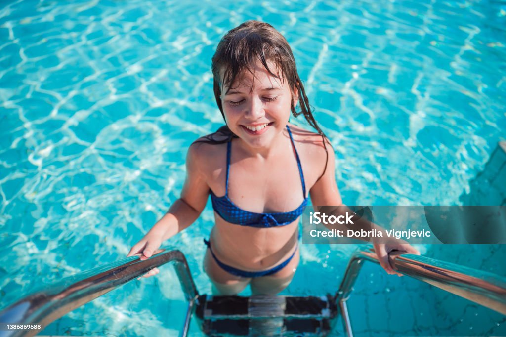 Happy Girl Leaving Swimming Pool Stock Photo - Download Image Now -  Swimwear, Bikini, Teenage Girls - iStock