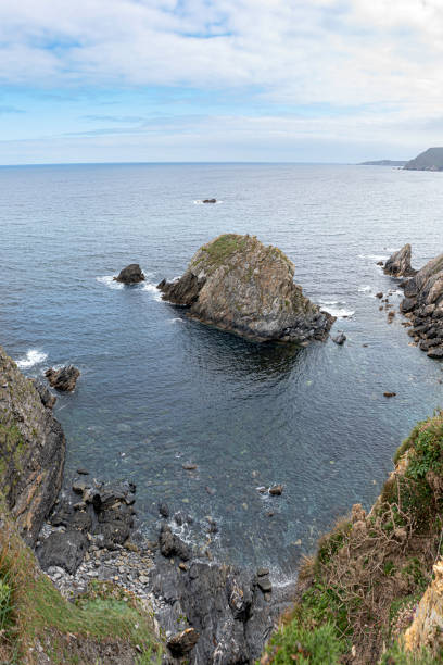 istock Ocean landscape with rocks and mountains 1386872601
