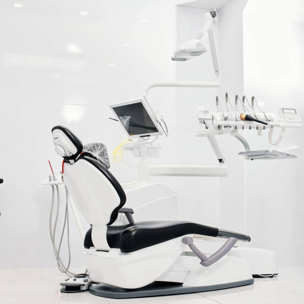 istock Dentist's dental office interior with unit, tools, lamps , ergonomic chair 1386872759
