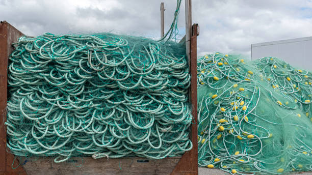 istock Green fishing nets with yellow floats 1386873052