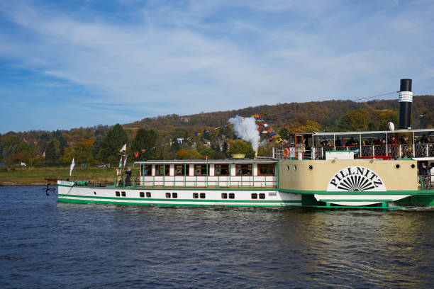 The paddle steamer "Pillnitz" on the river Elbe Dresden, Germany - October 31 2021: The paddle steamer 'Pillnitz' of the Sächsische Dampfschifffahrt on the river Elbe. Dresden has the oldest and largest paddle steamer fleet in the world. elbe valley stock pictures, royalty-free photos & images