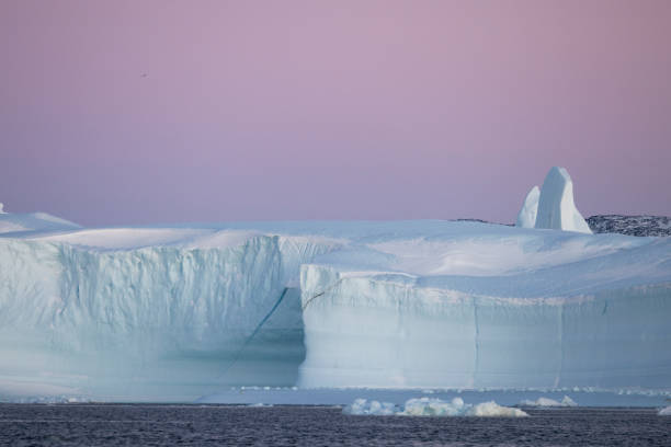 istock ICEBERGS FLOATING OVER SEA, TEXTURES AND COLORS 1386875817