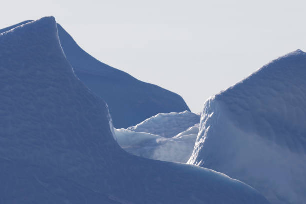 istock ICEBERGS FLOATING OVER SEA, TEXTURES AND COLORS 1386876101