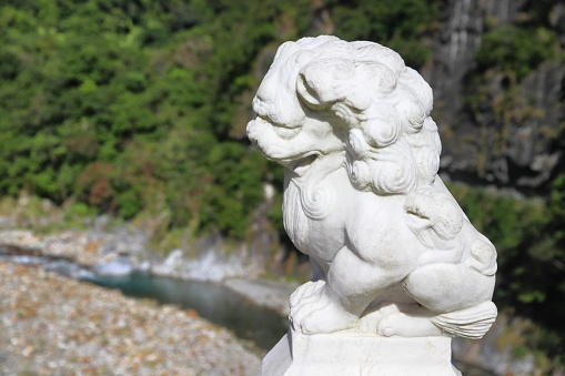 Chinese guardian lion statue on a bridge in Taroko Gorge, Taiwan.