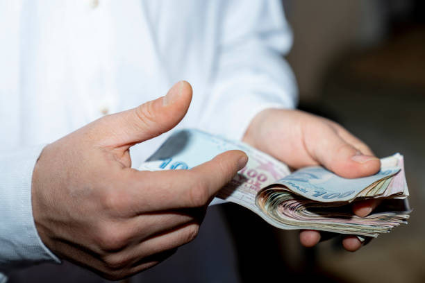 istock turkish lira and coin 1386876612