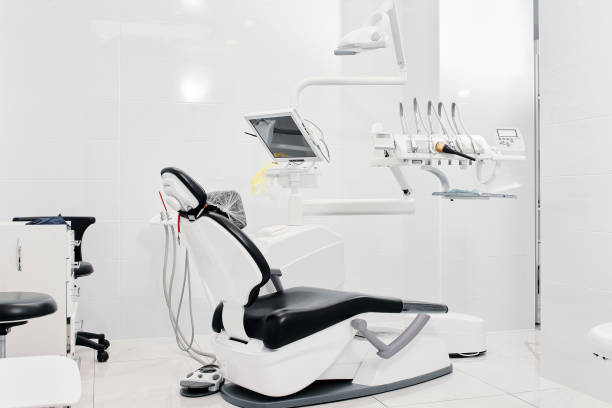 istock Dentist's dental office interior with unit, tools, lamps , ergonomic chair 1386878441