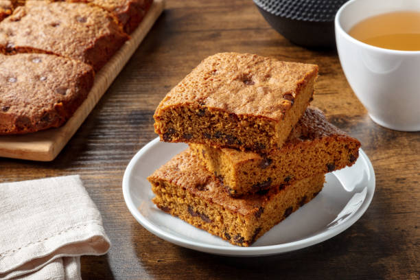 istock Blondie brownie dessert bars with chocolate chips, on a dark rustic wooden table 1386879100