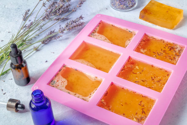 istock Soap making. Liquid glycerin with natural additives in a silicone mould 1386879145
