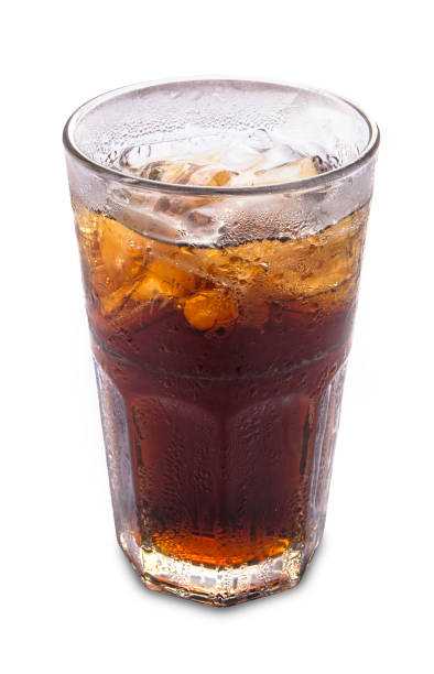 Glass of cola with ice on white background stock photo