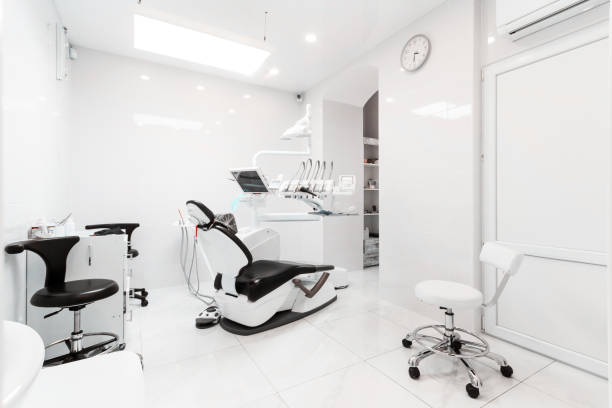 istock Dentist's dental office interior with unit, tools, lamps , ergonomic chair 1386879738