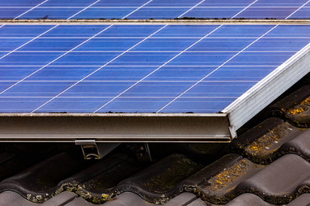 istock PV private system with energy-efficient blue solar panels on a private family house, Germany 1386881275
