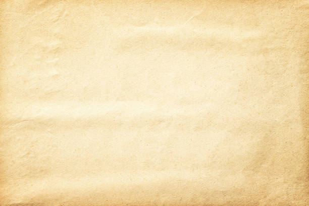 istock beige paper background, old faded page texture 1386881498