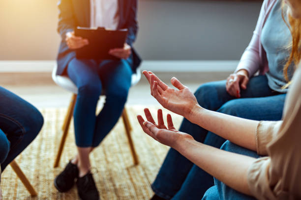 istock Close-up of therapist's hands explaining a problem to his patients 1386881839
