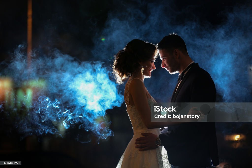 I will love you all days and all my nights Young newlywed couple hugging in the city at night Elegance Stock Photo