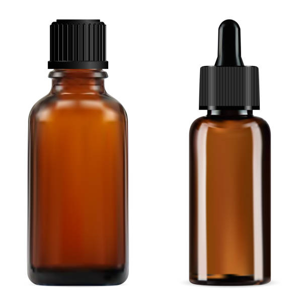istock Brown essential oil bottle. Small amber glass vial 1386884315