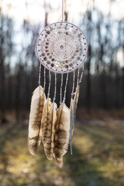 istock Handmade dream catcher with feathers threads and beads rope hanging 1386885407