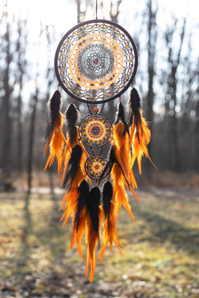 istock Handmade dream catcher with feathers threads and beads rope hanging 1386885411