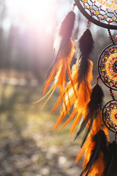 istock Handmade dream catcher with feathers threads and beads rope hanging 1386885415