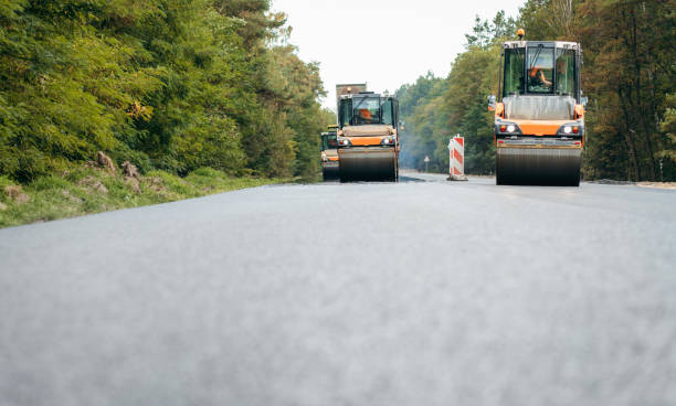 istock Vibratory asphalt rollers compactor compacting new asphalt pavement. Road service repairs the highway 1386885642