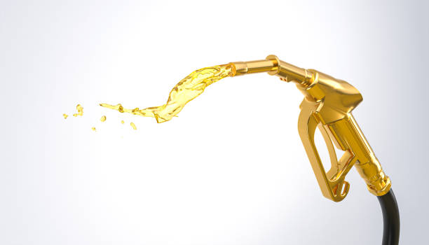 istock gold gasoline pump on the white background. 1386888474