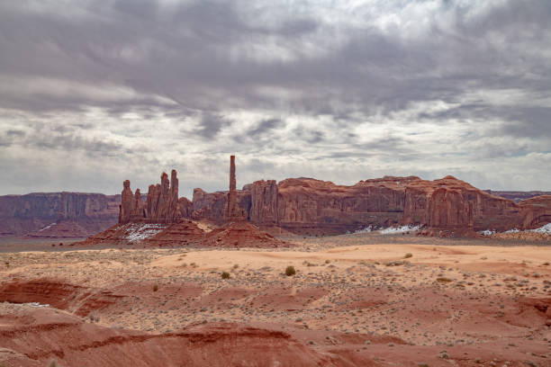 istock Scenic view with dramatic clouds from dirt road in Monument Valley made famous by western movies 1386895837