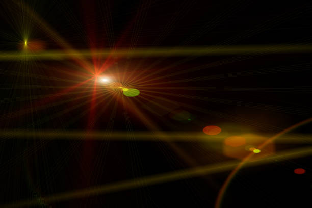 Easy to add lens flare effects for overlay designs or screen blending mode to make high-quality images. Abstract sun burst, digital flare, iridescent glare over black background.