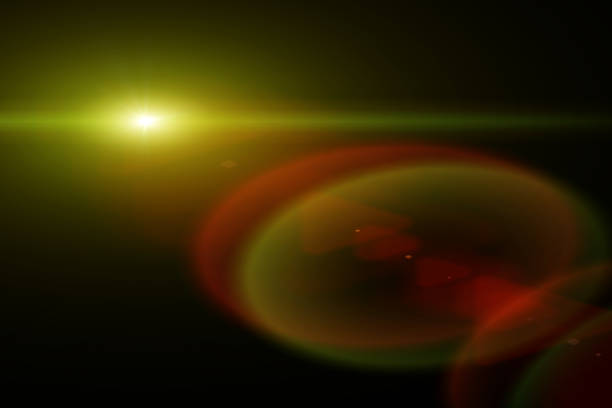 istock Abstract sun burst, digital flare, iridescent glare over black background. 1386897251