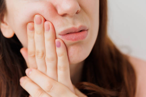 istock Young handsome young woman expression of horrible suffer from toothache 1386897264