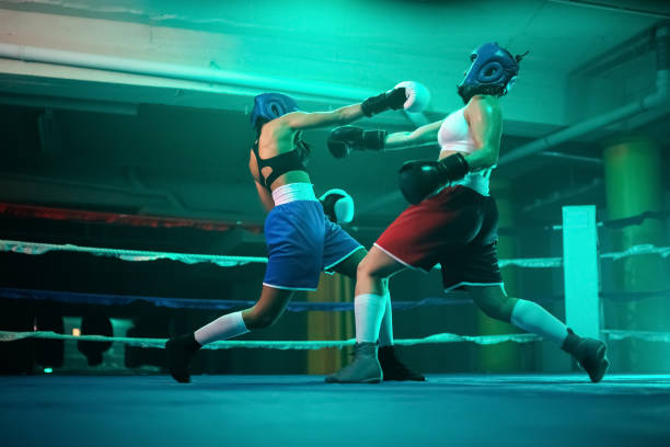 istock Qualified female boxers boxing in gym 1386897266