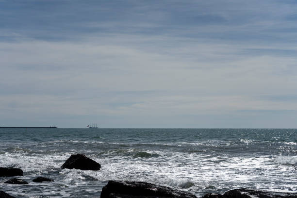istock Frigate anchored near the beach 1386897386