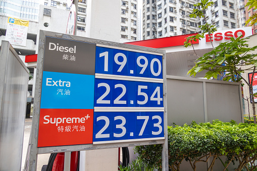 Hong Kong - March 18, 2022 : Price board for Diesel, Extra and Supreme+ are displayed at the Esso gas station is seen in Happy Valley, Hong Kong.