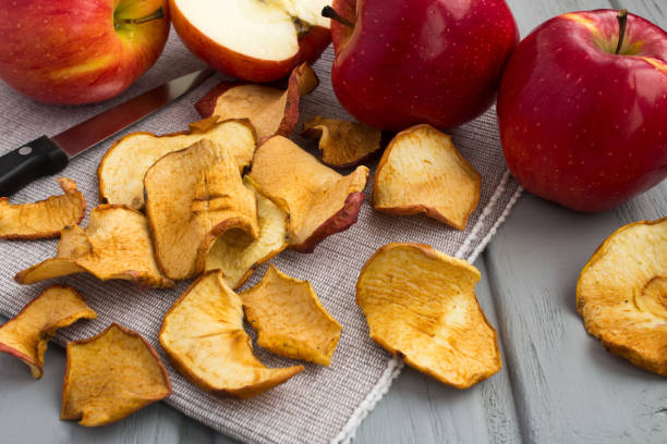 istock Apple chips on the gray wooden background. Close-up. 1386898963