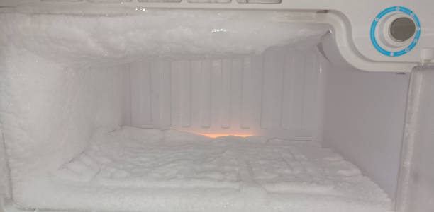 istock Thick ice build up on deep freezer lid 1386899094