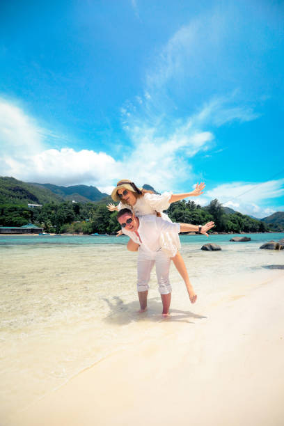 Happy couple enjoys life on a tropical island stock photo