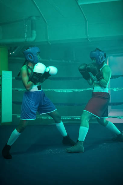 istock Strong girls preparing for boxing match together 1386899355