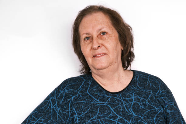 istock Contented senior woman smiles gently 1386899360