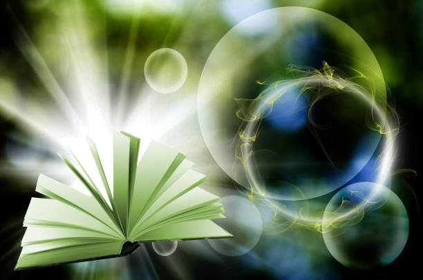 istock Open book on an abstract green background 1386899456