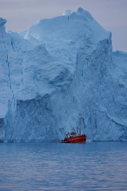 istock Big icebergs floating over sea in artic polar circle 1386900138