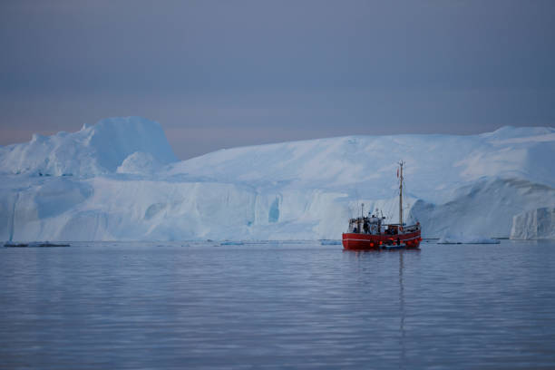 istock Big icebergs floating over sea in artic polar circle 1386900161