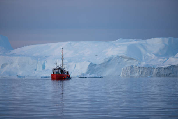 istock Big icebergs floating over sea in artic polar circle 1386900165