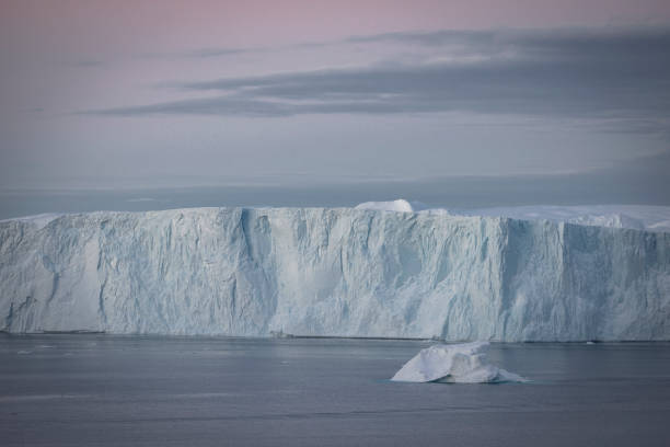 istock Big icebergs floating over sea in artic polar circle 1386900194