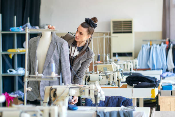 istock Female clothes designer working in her studio 1386901922